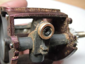 Shimano Scorpion before service — debris on front of reel